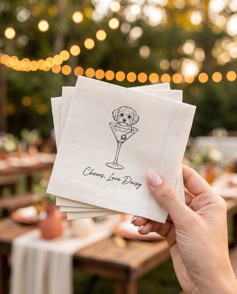 Hand holding a stack of personalized pet cocktail napkins